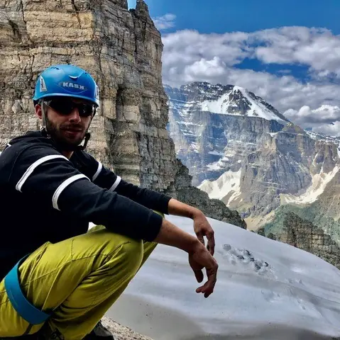 photo of Chaz Misuraca sitting on a mountain